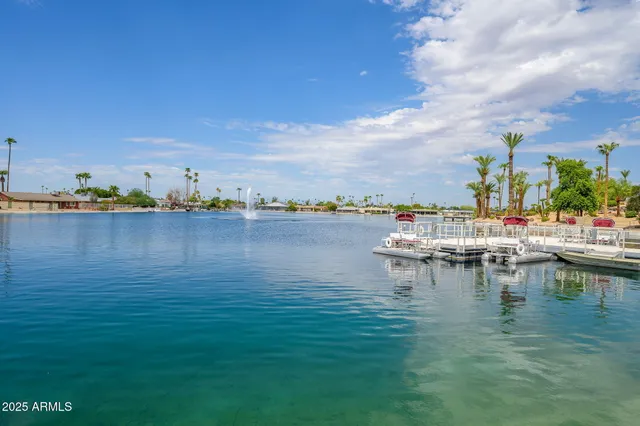 a view of backyard with swimming pool and outdoor seating
