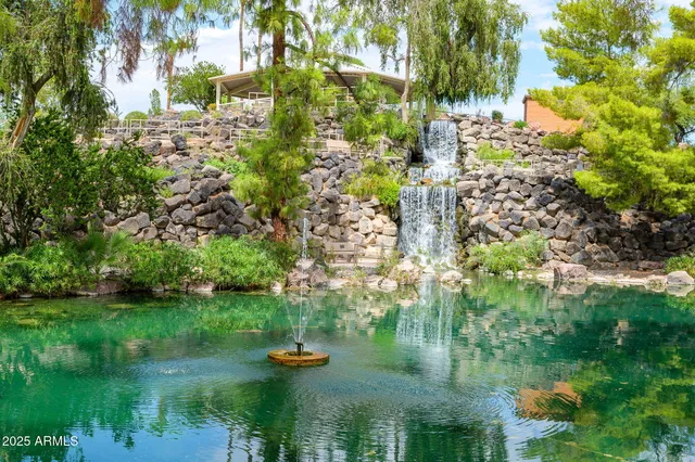 an aerial view of a residential houses with outdoor space and street view