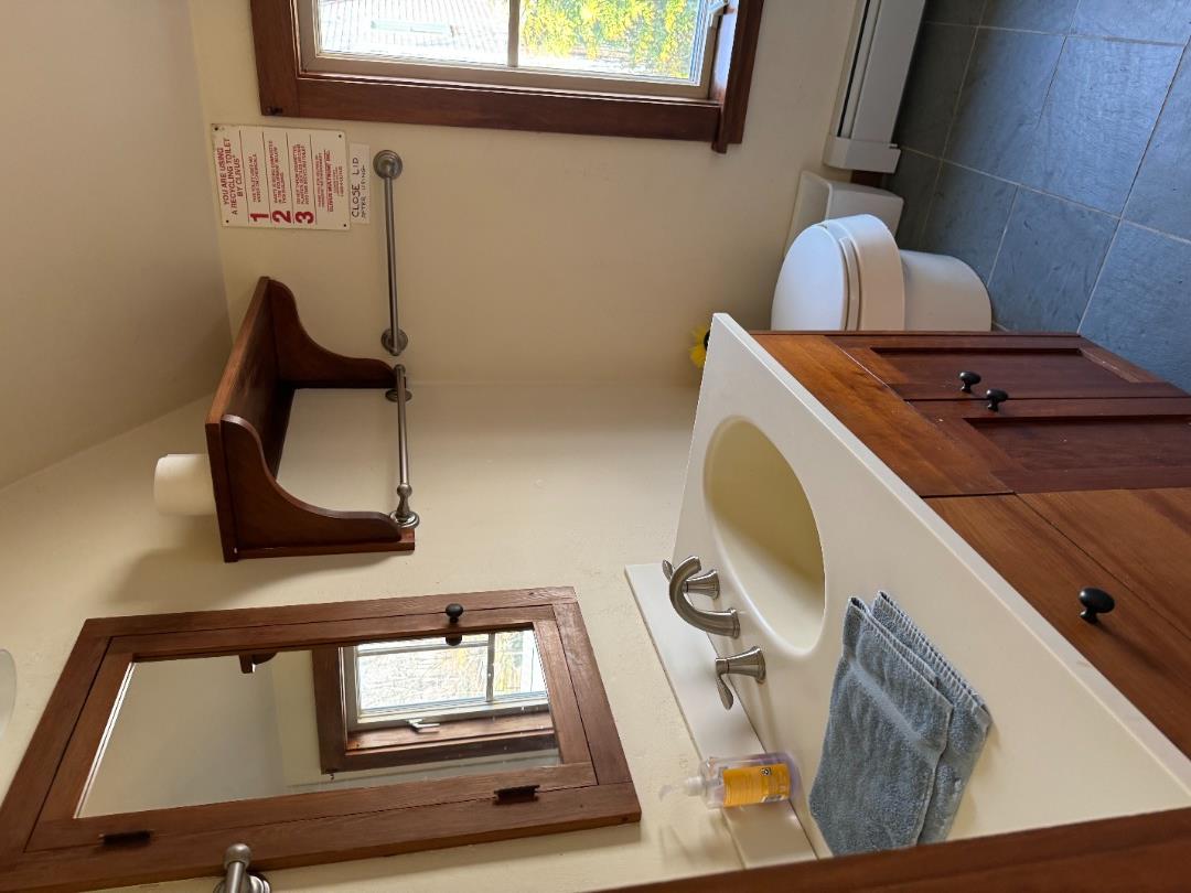 4 Rock Pond Road West Tisbury, MA 02568 - Photo 20 of 37 a bathroom with a sink a toilet and mirror