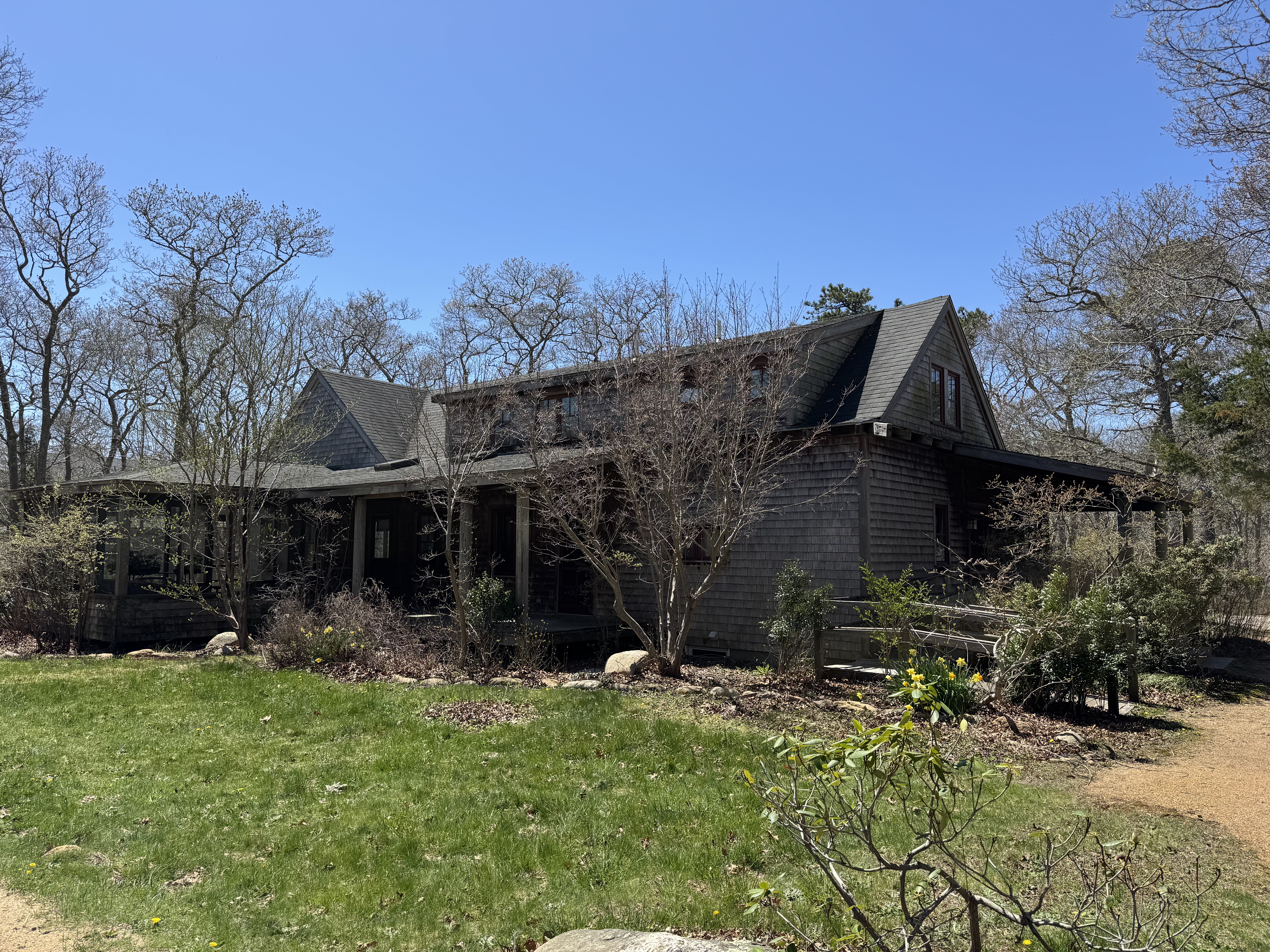 4 Rock Pond Road West Tisbury, MA 02568 - Photo 35 of 37 a backyard of a house with lots of green space