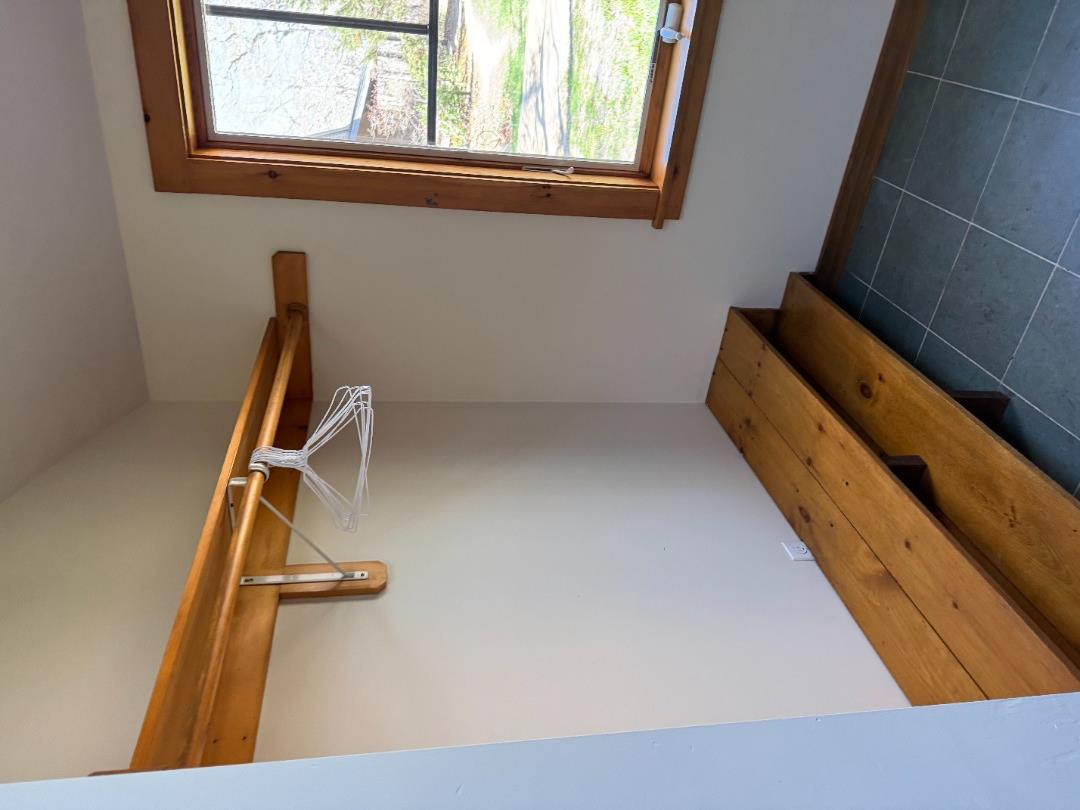 4 Rock Pond Road West Tisbury, MA 02568 - Photo 5 of 37 a view of a room with rack on the wall and a window