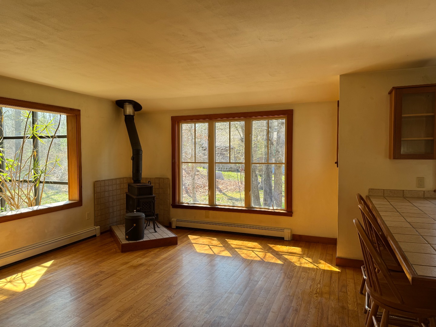 4 Rock Pond Road West Tisbury, MA 02568 - Photo 9 of 37 a living room with fireplace furniture and a large window
