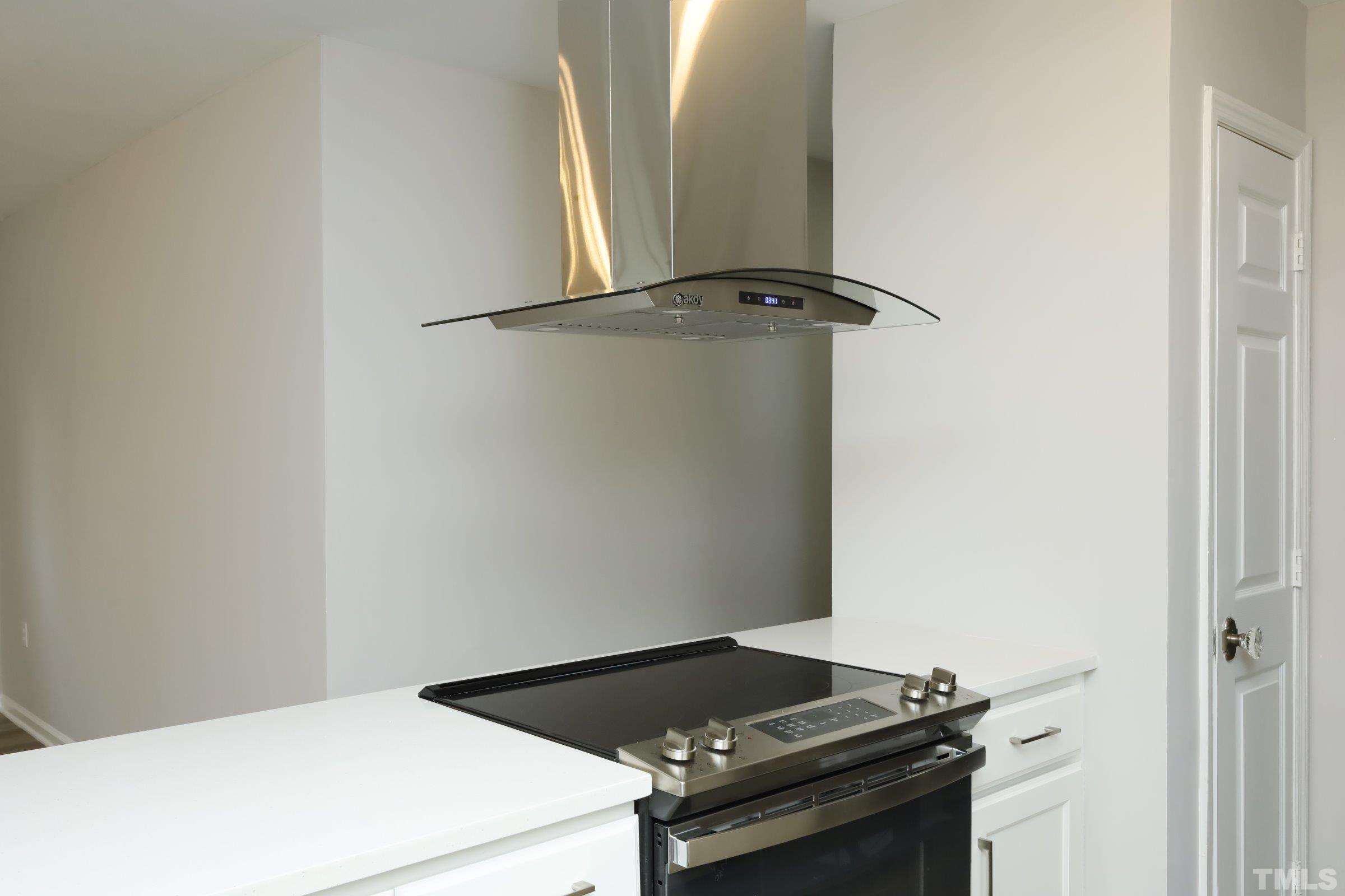 100 Mitchener Street Garner, NC 27529 - Photo 11 of 37 a close up of a stove in a kitchen