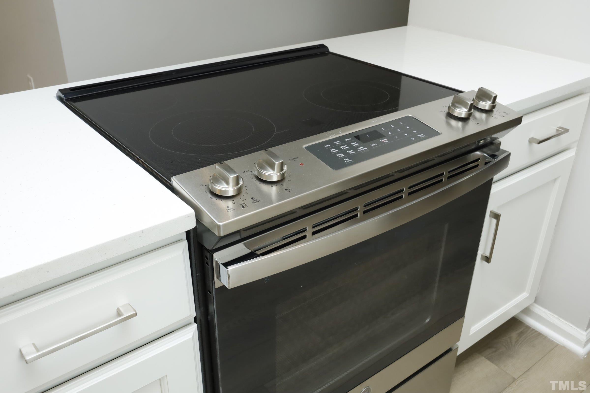 100 Mitchener Street Garner, NC 27529 - Photo 12 of 37 a close up of a stove top oven