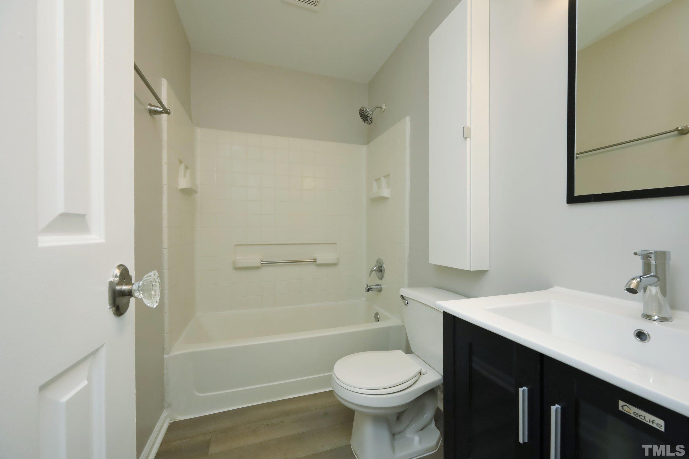 100 Mitchener Street Garner, NC 27529 - Photo 15 of 37 a bathroom with a sink a toilet and shower