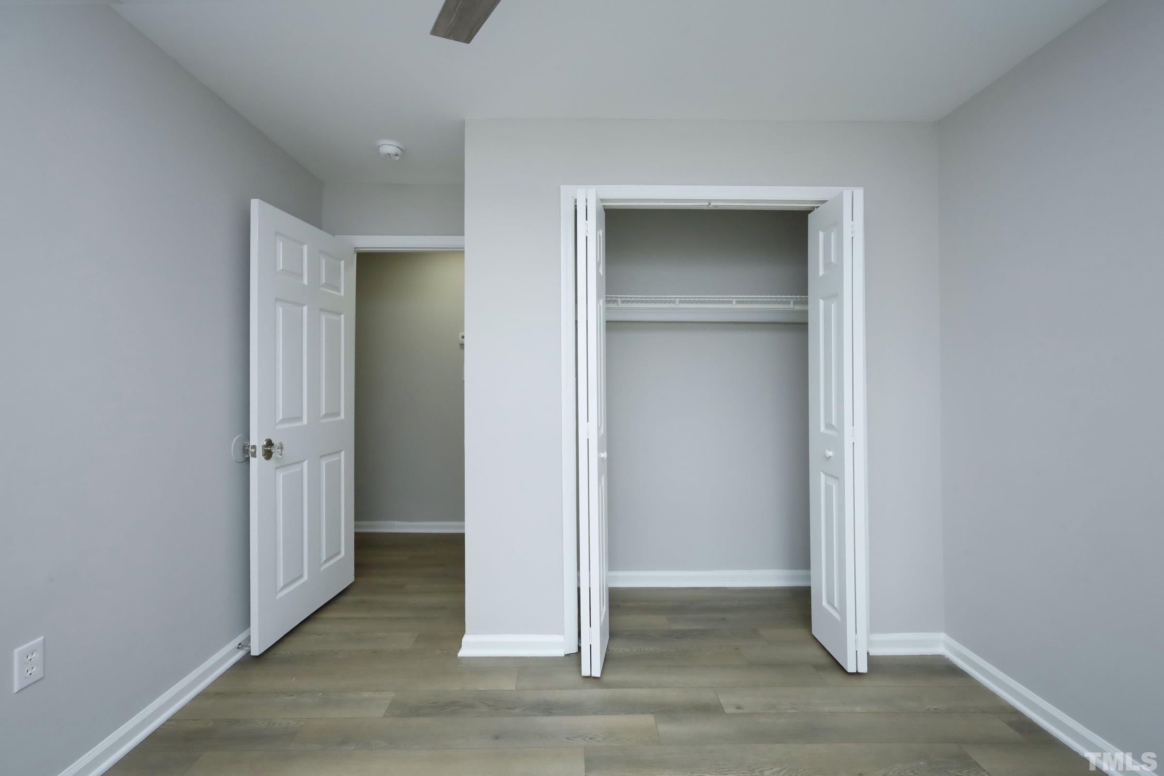 100 Mitchener Street Garner, NC 27529 - Photo 18 of 37 an empty room with closet and wooden floor