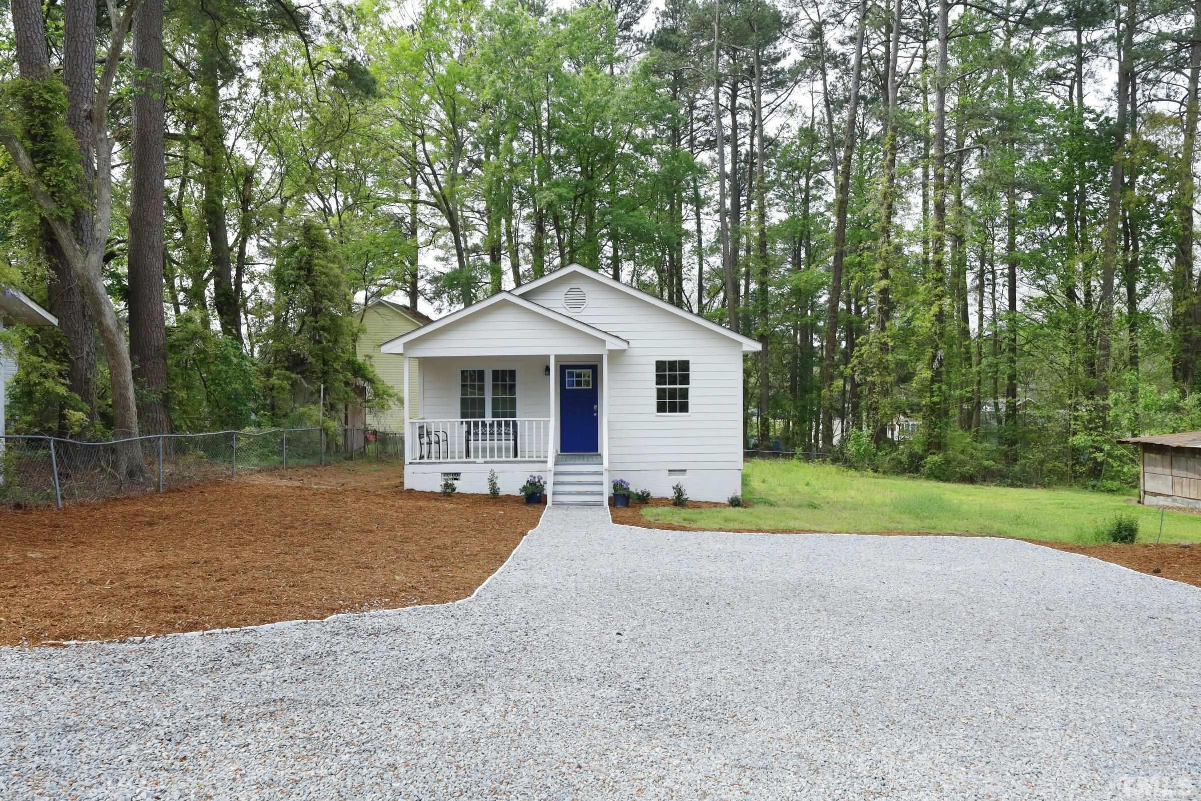 100 Mitchener Street Garner, NC 27529 - Photo 2 of 37 a front view of a house with garden