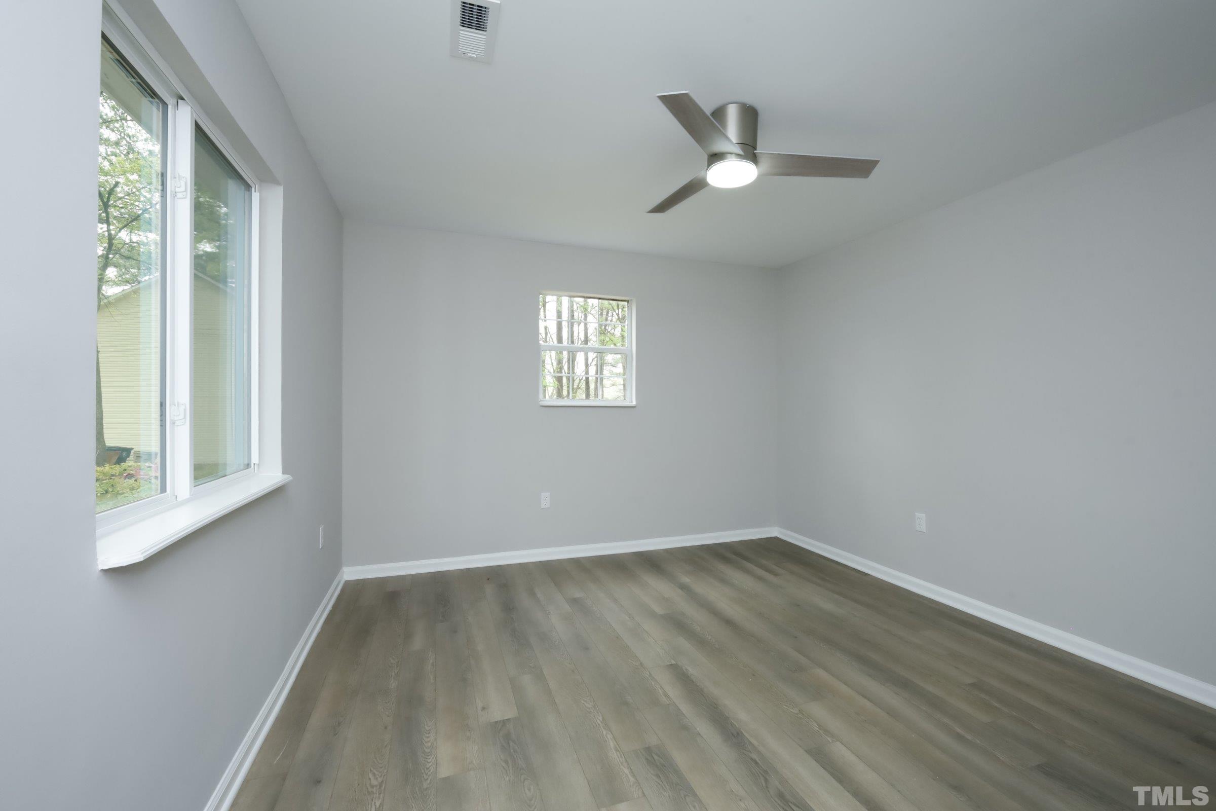 100 Mitchener Street Garner, NC 27529 - Photo 24 of 37 wooden floor in an empty room with a window