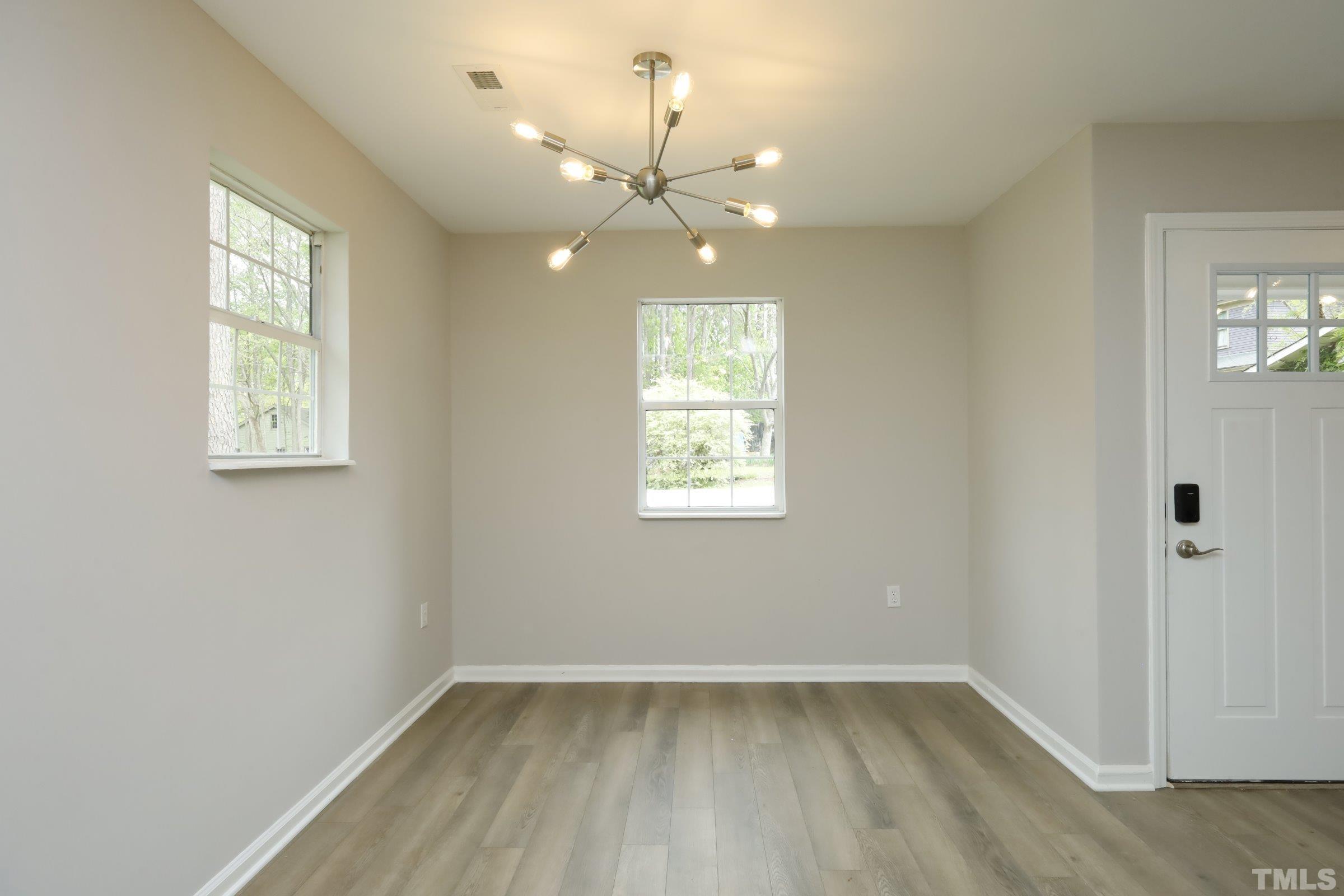 100 Mitchener Street Garner, NC 27529 - Photo 26 of 37 wooden floor in an empty room with a window