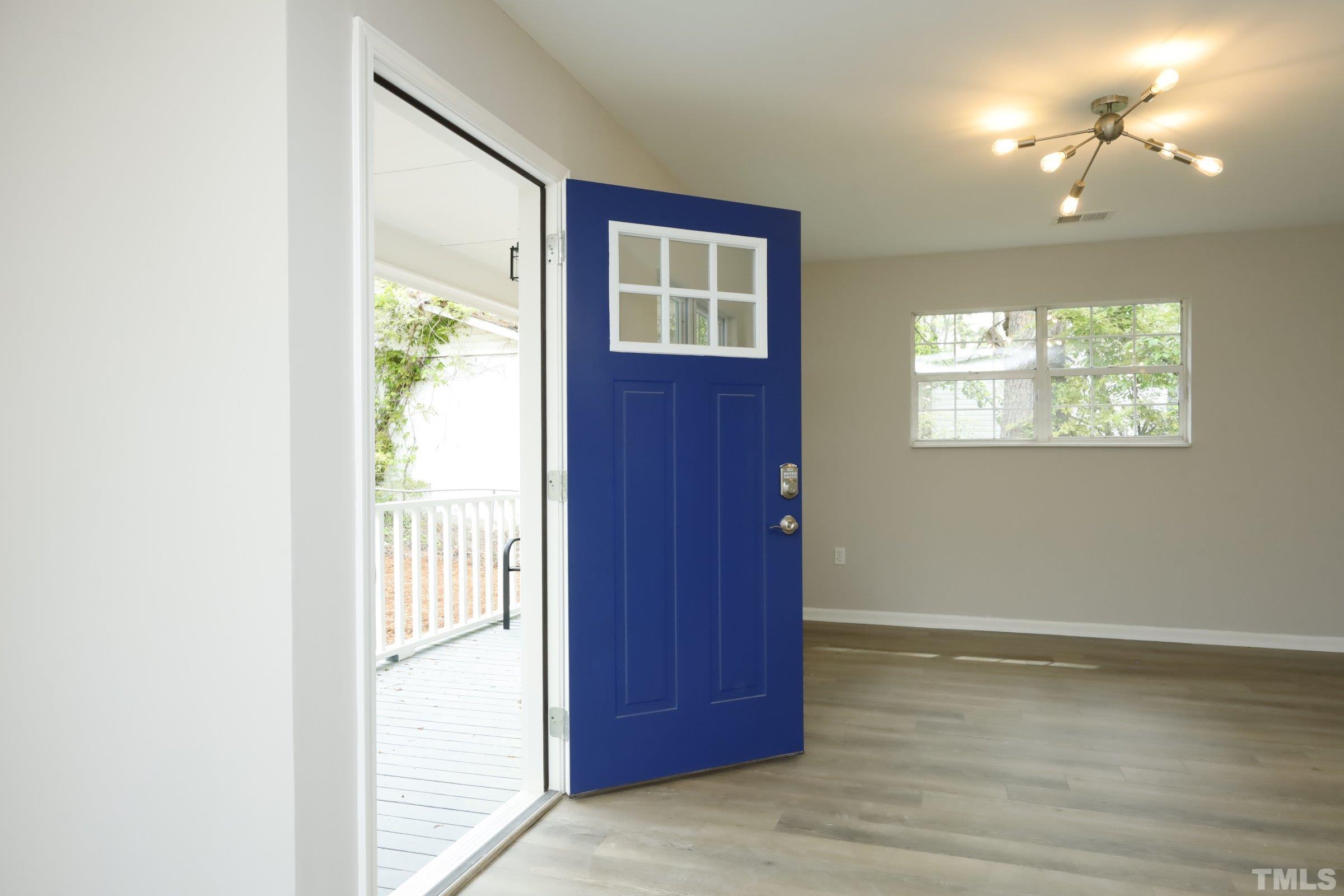 100 Mitchener Street Garner, NC 27529 - Photo 30 of 37 a view of an empty room with wooden floor and windows