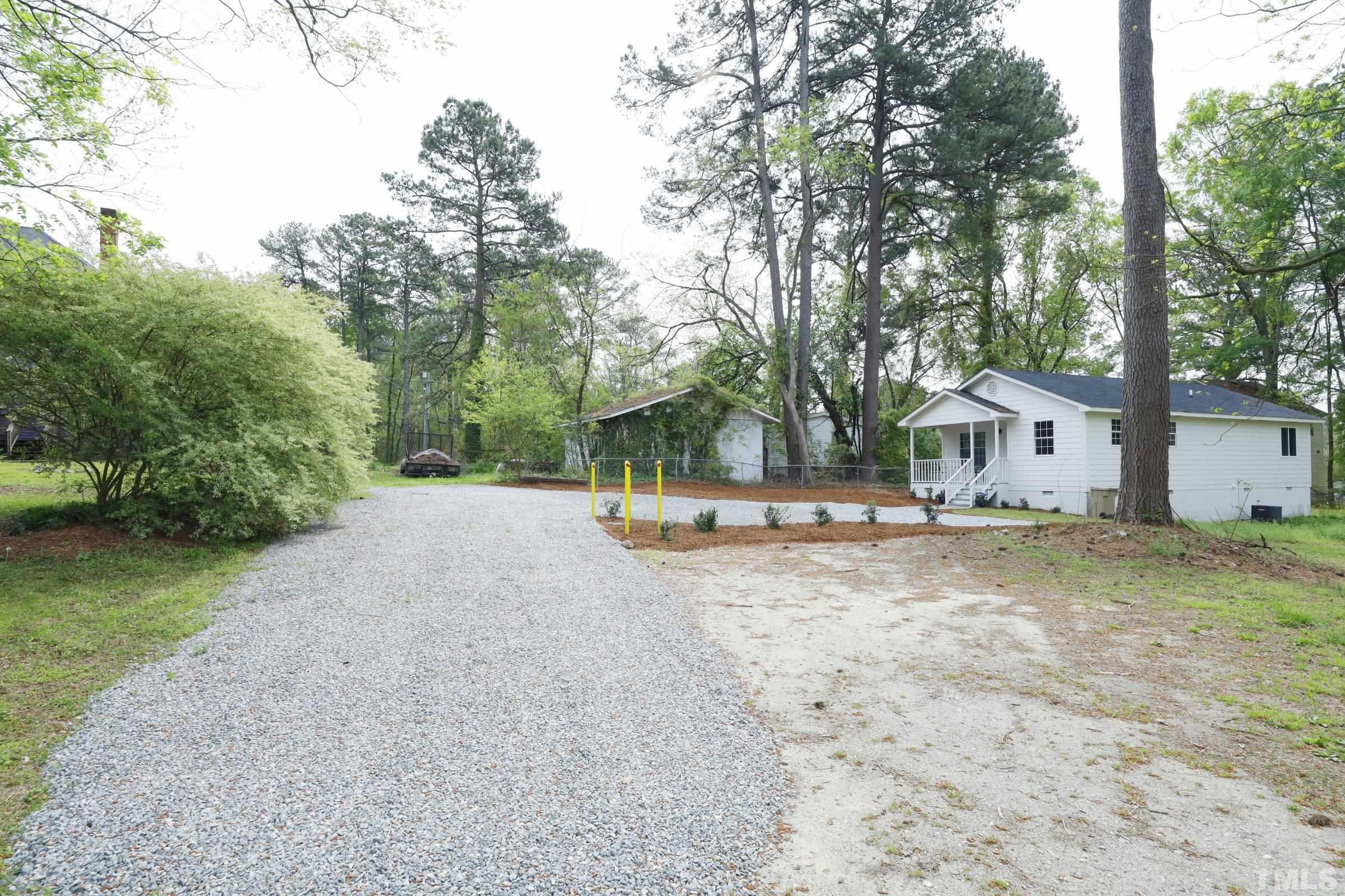 100 Mitchener Street Garner, NC 27529 - Photo 36 of 37 a view of a house with backyard and trees
