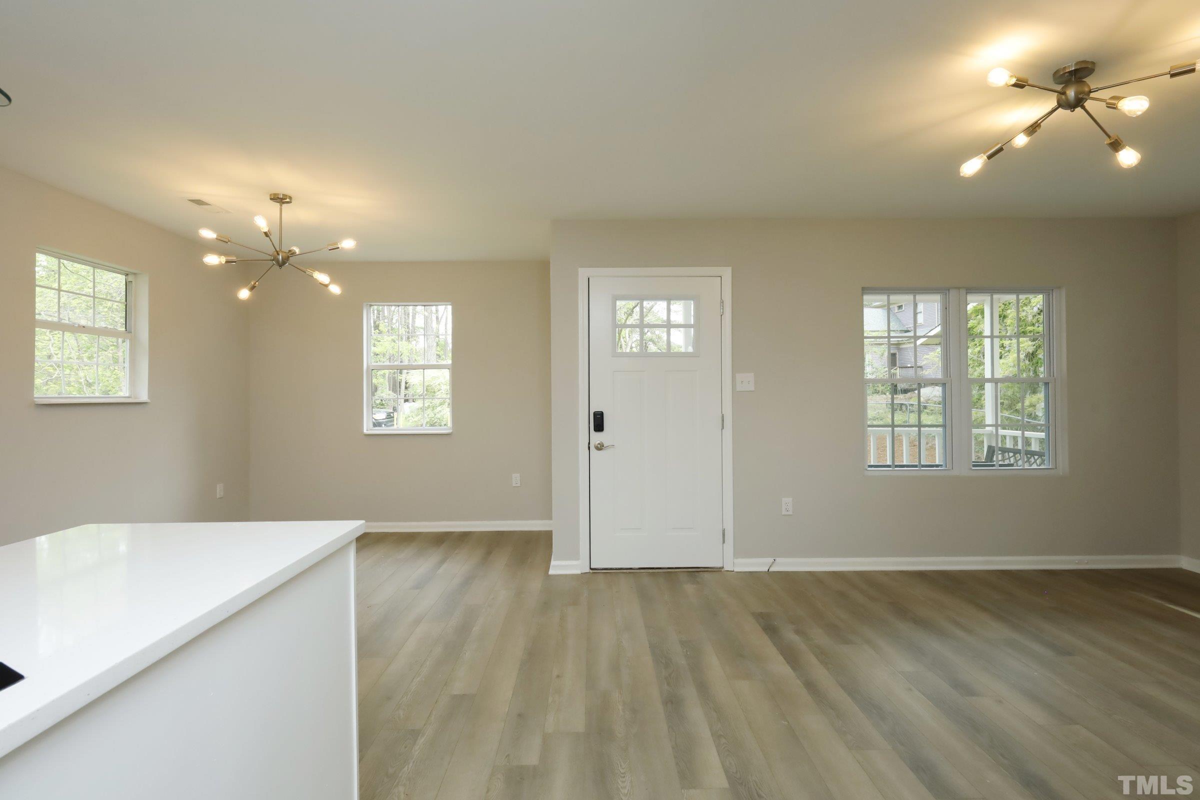 100 Mitchener Street Garner, NC 27529 - Photo 5 of 37 a view of livingroom with hardwood floor and hallway