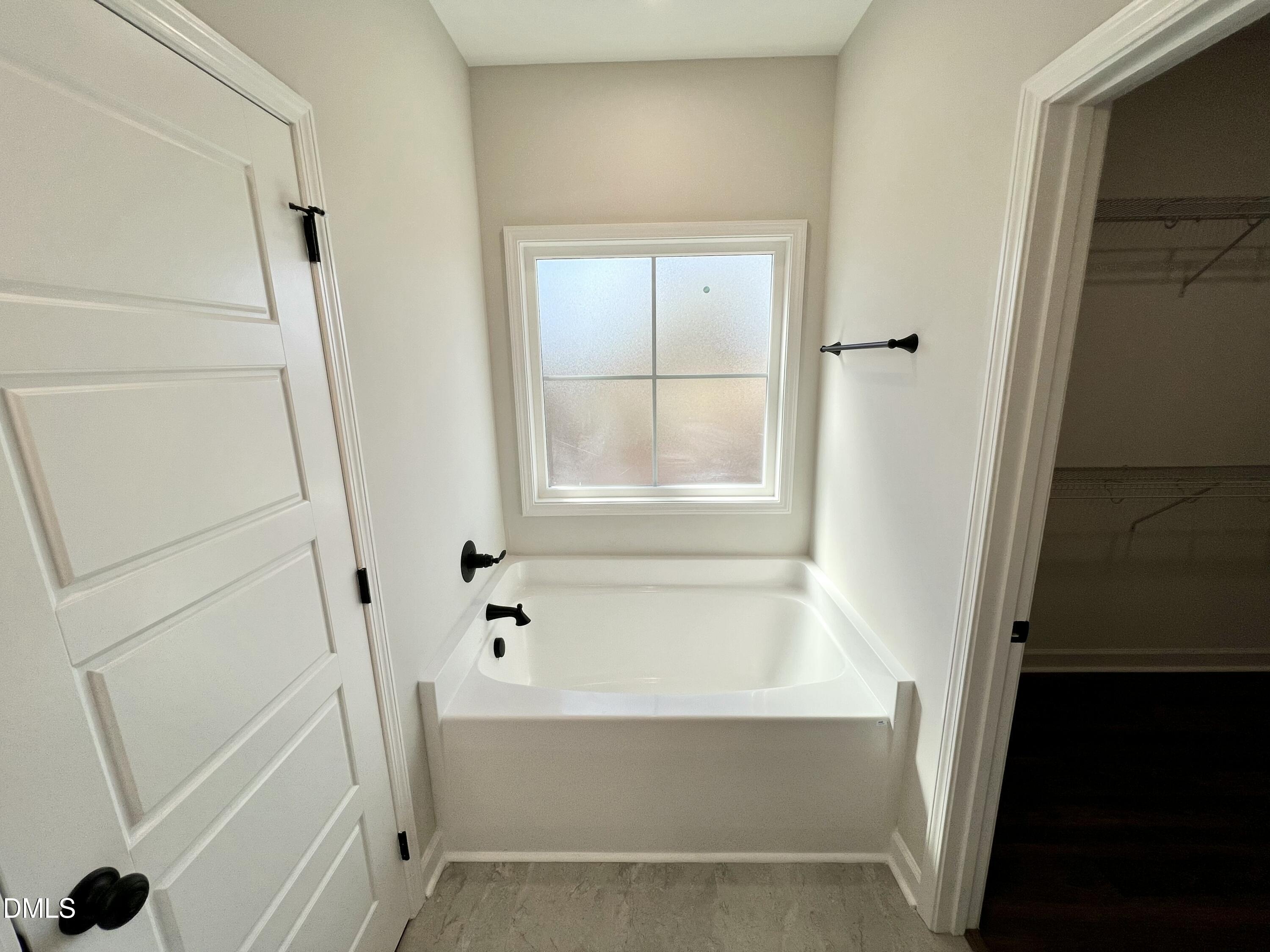 1787 Walnut Run Drive Deep Run, NC 28525 - Photo 12 of 23 a bathroom with a tub and a shower