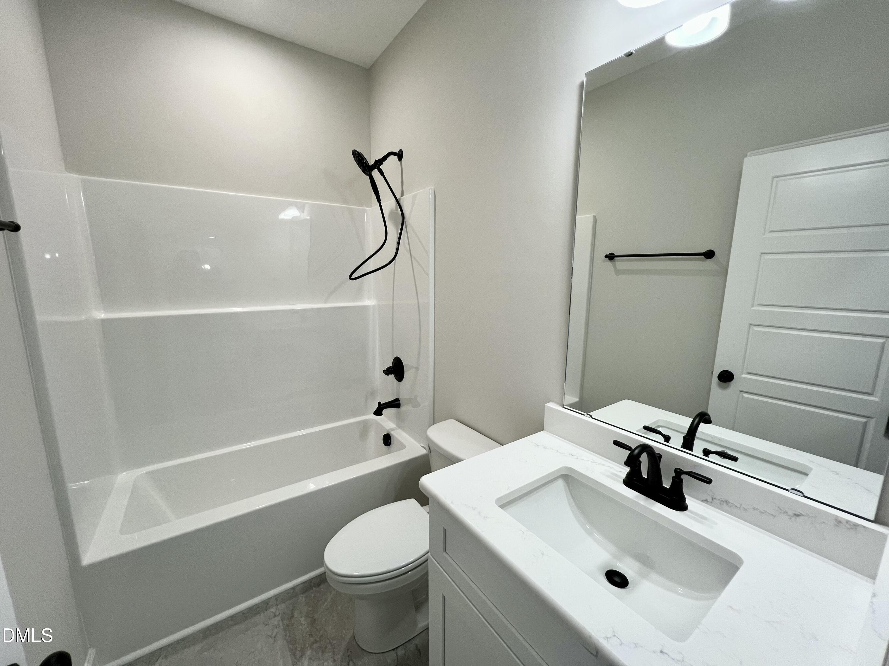 1787 Walnut Run Drive Deep Run, NC 28525 - Photo 18 of 23 a bathroom with a sink toilet and shower