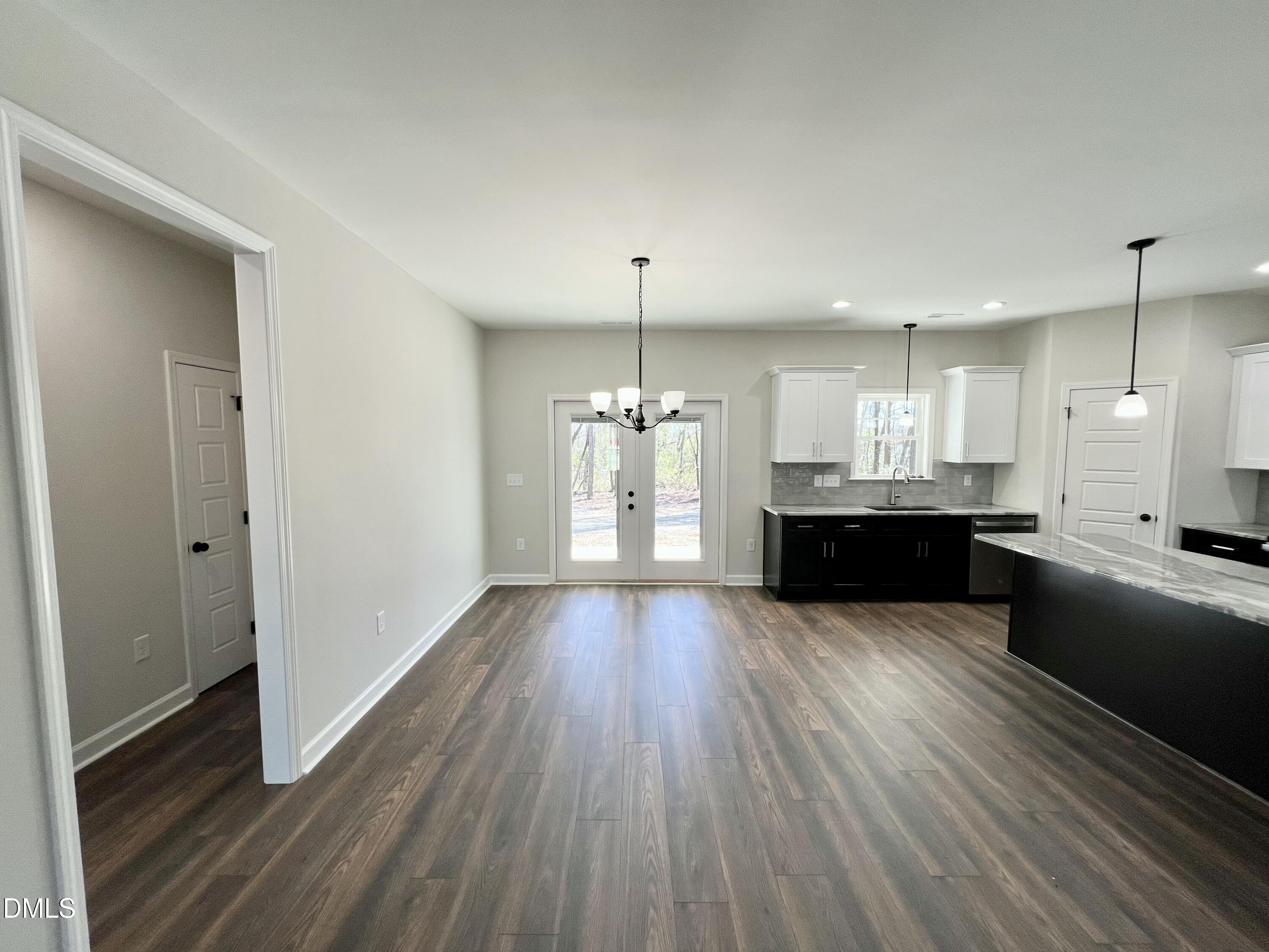 1787 Walnut Run Drive Deep Run, NC 28525 - Photo 5 of 23 a large kitchen with cabinets wooden floor and a sink