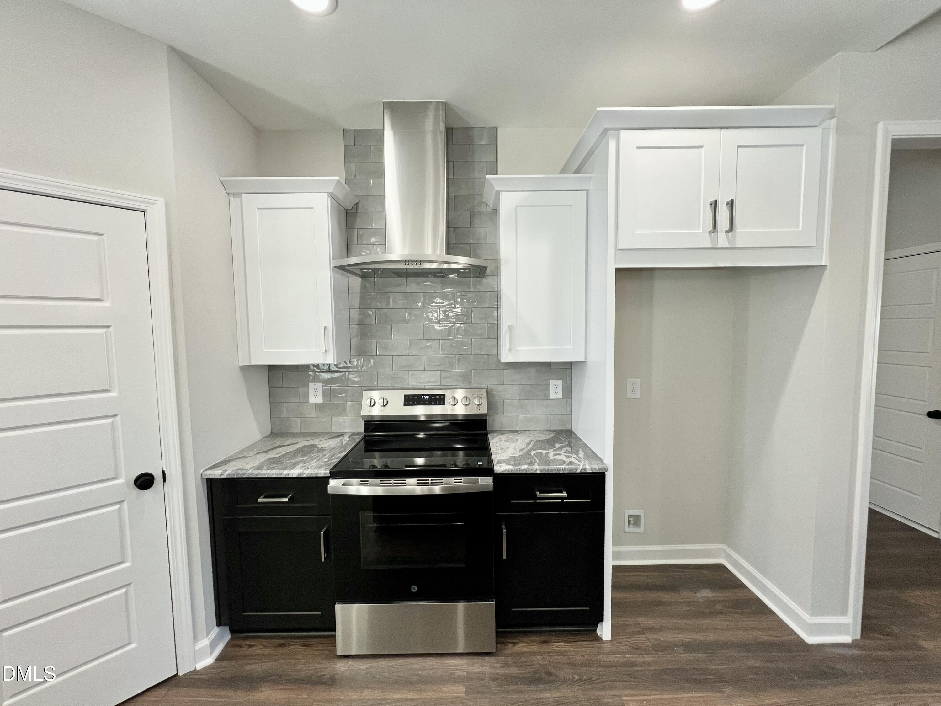 1787 Walnut Run Drive Deep Run, NC 28525 - Photo 6 of 23 a kitchen with a stove and cabinets