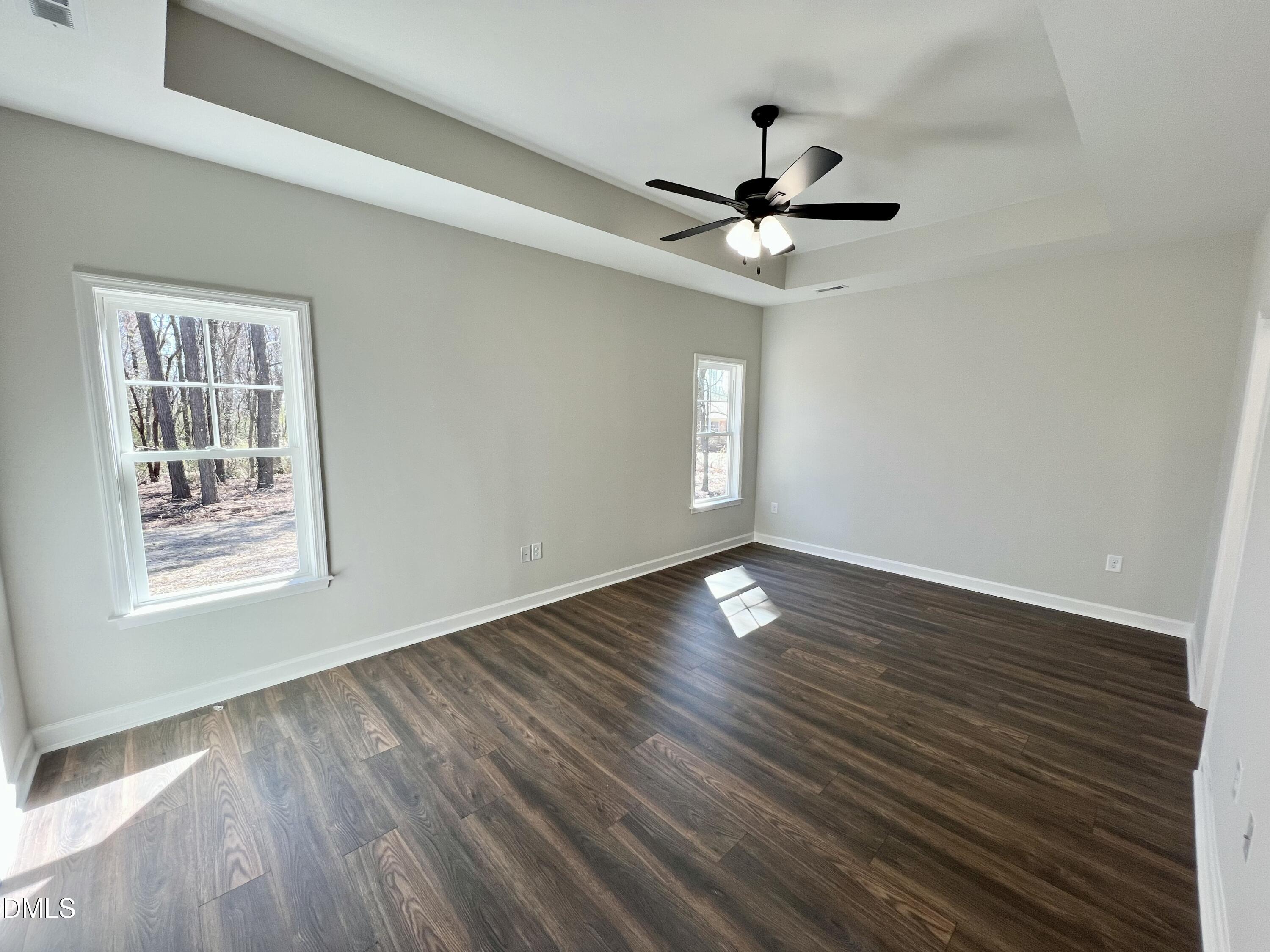 1787 Walnut Run Drive Deep Run, NC 28525 - Photo 9 of 23 a view of an empty room with wooden floor and a window