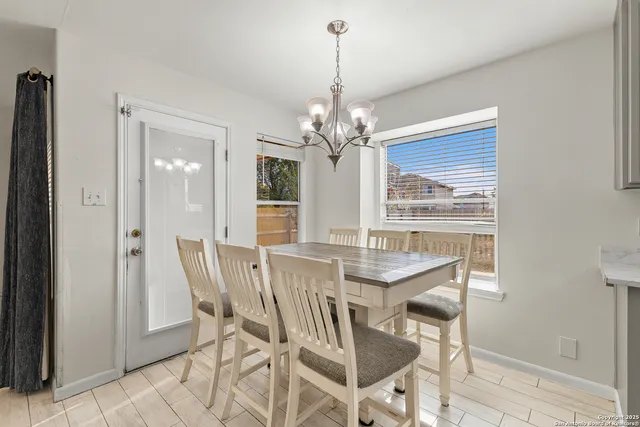 a dining room with furniture and window