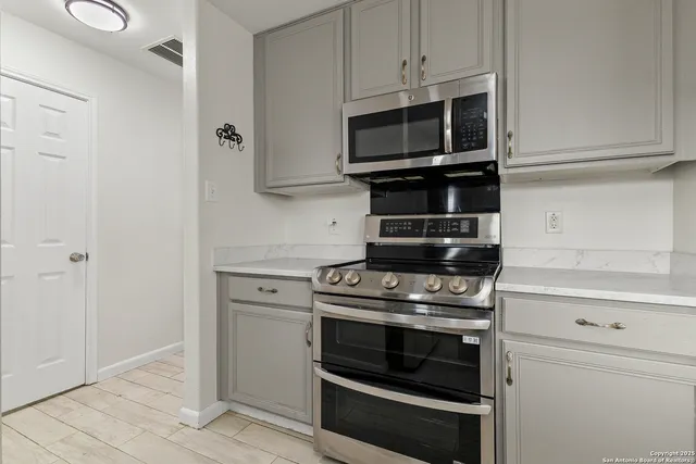 a kitchen with a stove and a microwave