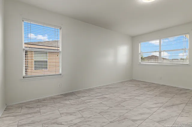 a view of an empty room with a window