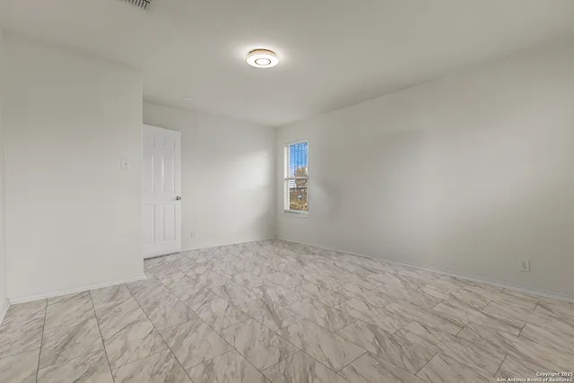 a view of an empty room and window