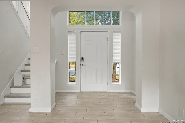 a view of an entryway with hallway