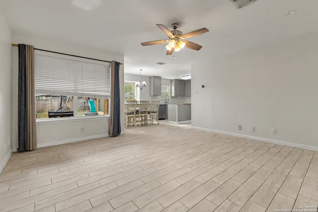 a view of a kitchen with a sink and cabinets