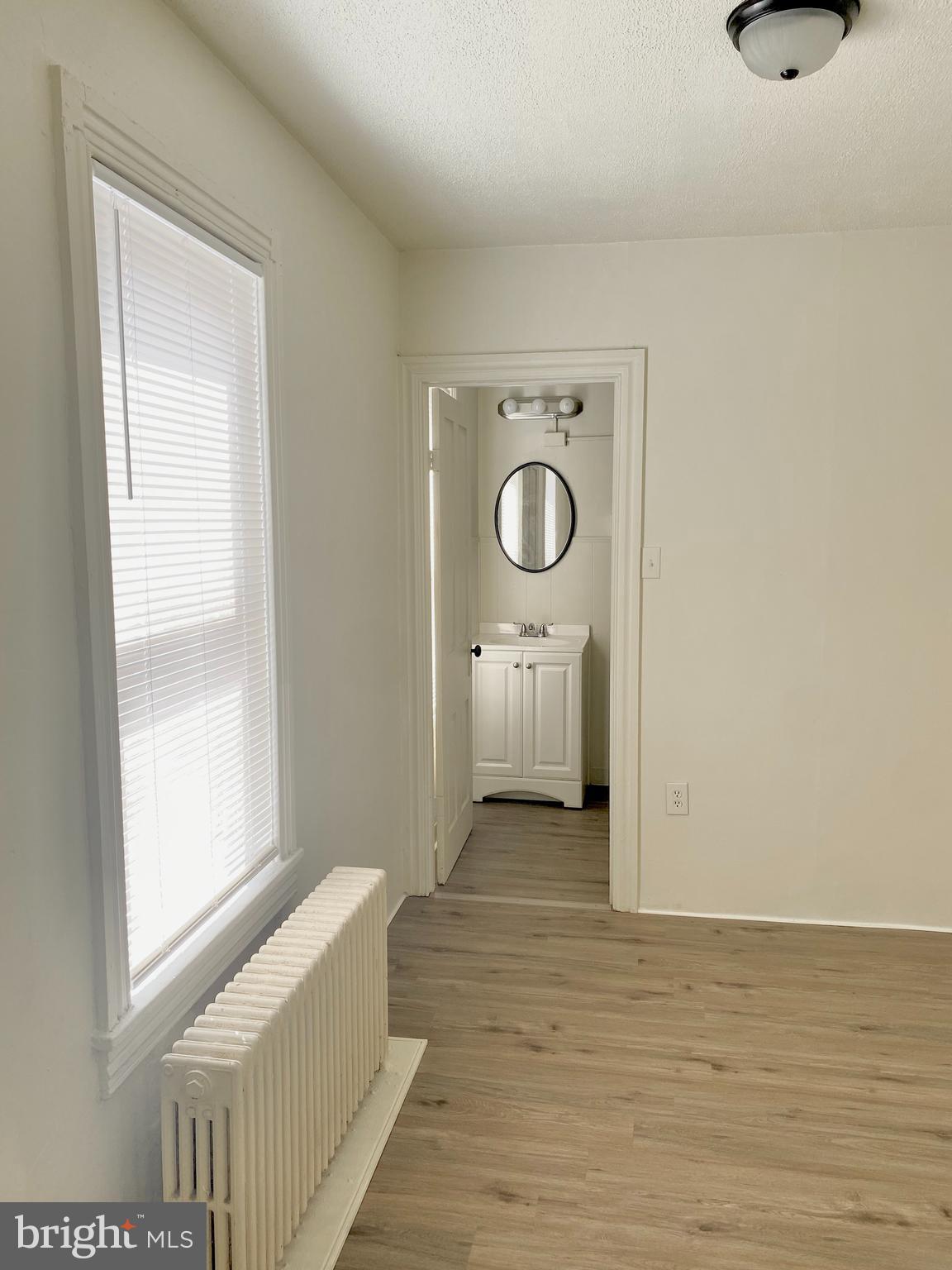 424 Locust Street Reading, PA 19604 - Photo 11 of 17 a bedroom with a bed and a window