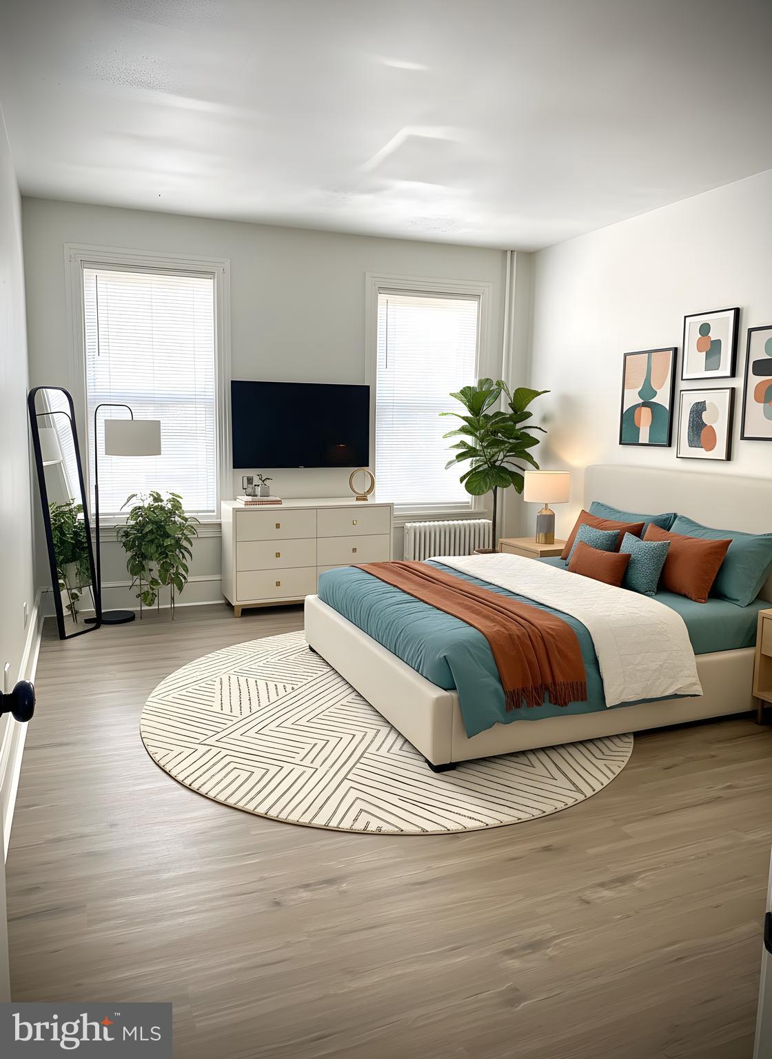 424 Locust Street Reading, PA 19604 - Photo 13 of 17 a bedroom with a large bed and a flat screen tv