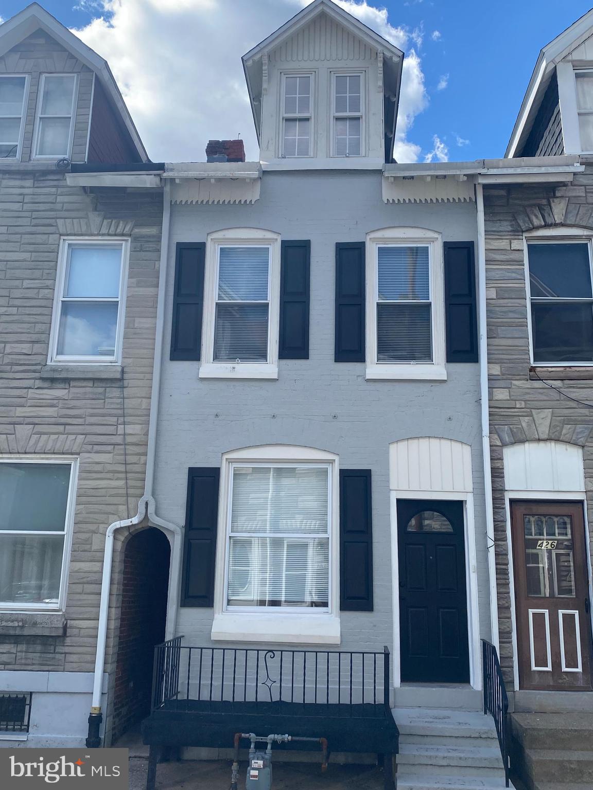 424 Locust Street Reading, PA 19604 - Photo 2 of 17 a front view of a house with a porch