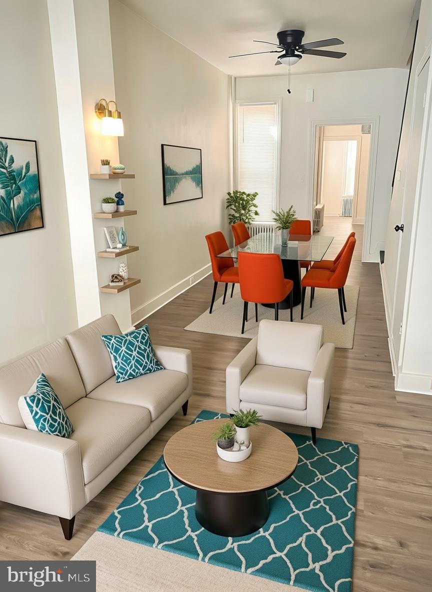 424 Locust Street Reading, PA 19604 - Photo 4 of 17 a living room with furniture and a dining table with wooden floor