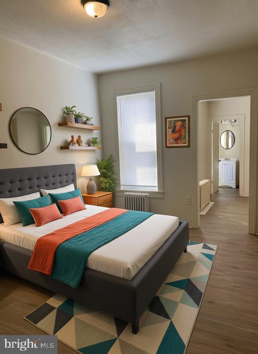 424 Locust Street Reading, PA 19604 - Photo 9 of 17 a bedroom with a bed lamp closet and window