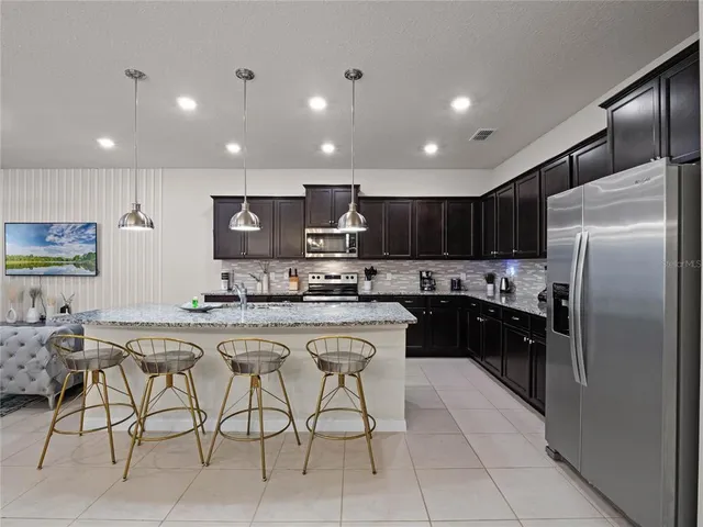 a room with pool table and windows