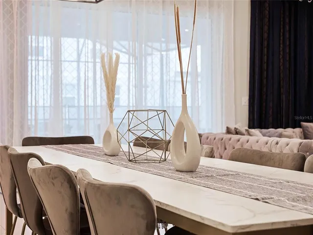 a bedroom with a bed table and a window