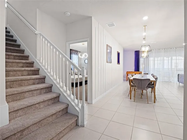 a bench in a kitchen next to a window