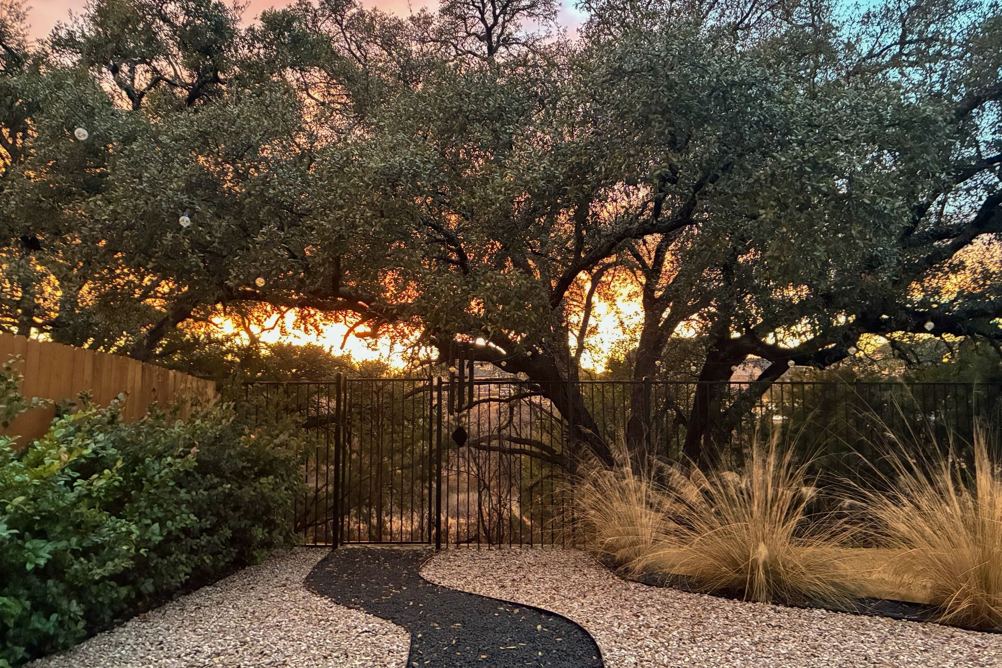 Come home to incredible sunset views! The landscaped backyard with an extended stone patio is a wonderful place to start and end your day.