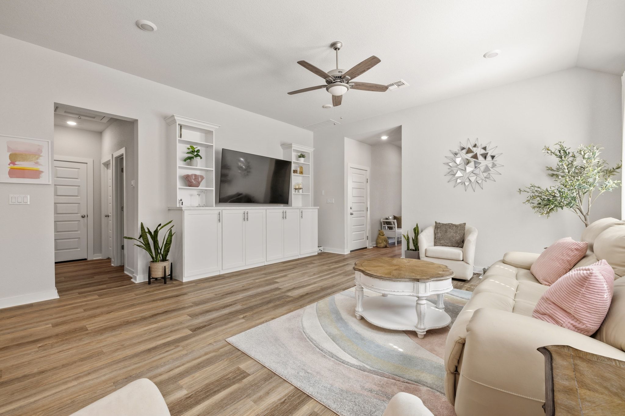 1006 Summer Glen Georgetown, TX 78628 - Photo 12 of 40 A custom built-in entertainment center serves as the focal point of the room, offering integrated storage and media space
