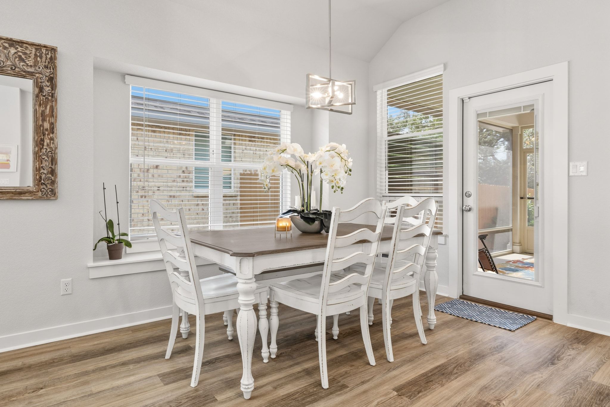 1006 Summer Glen Georgetown, TX 78628 - Photo 21 of 40 The dining area sits directly between the kitchen and the wall of windows, providing a central spot for a full-sized table