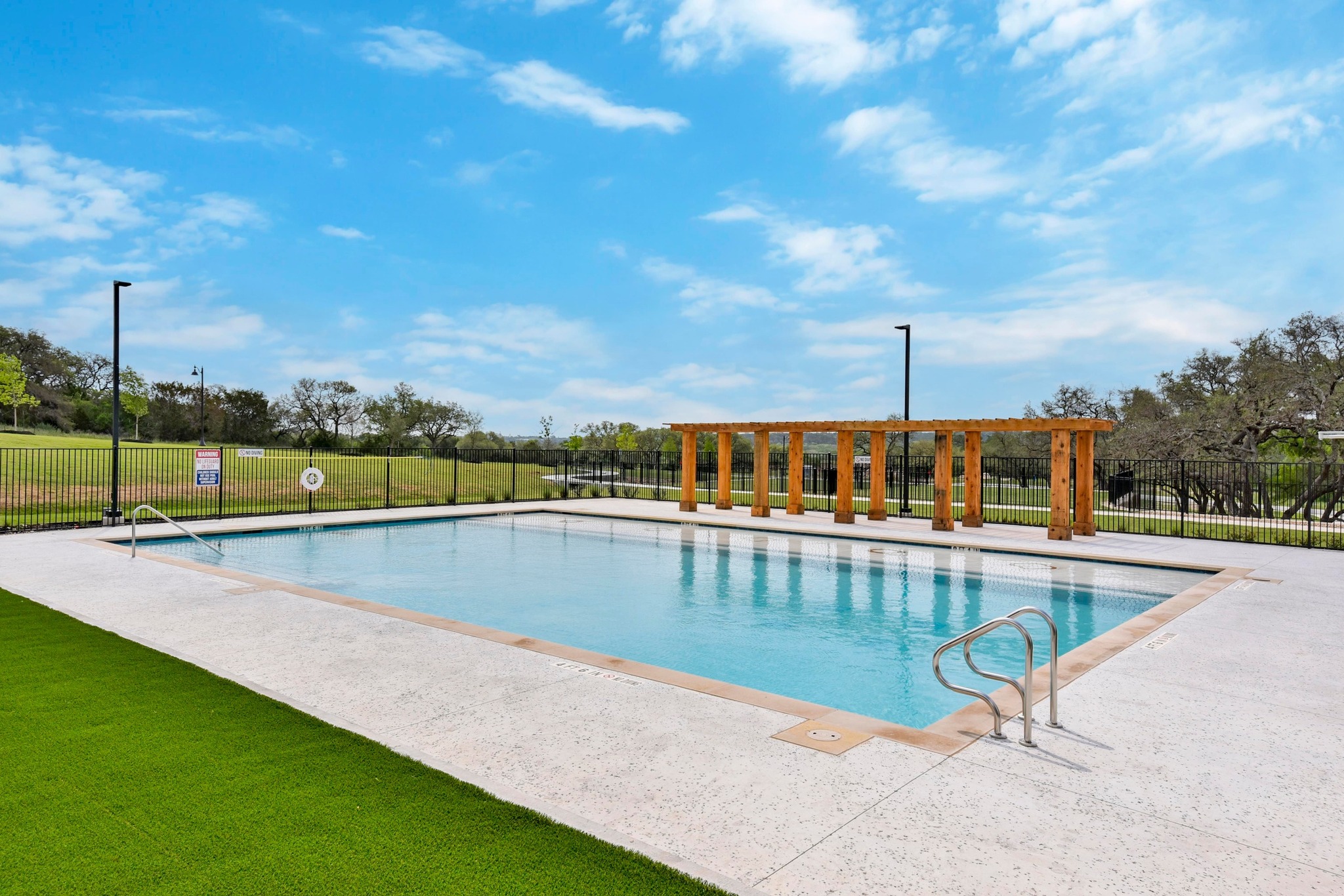 1006 Summer Glen Georgetown, TX 78628 - Photo 37 of 40 A large sundeck surrounds the community pool, offering plenty of space for lounging and gathering with neighbors