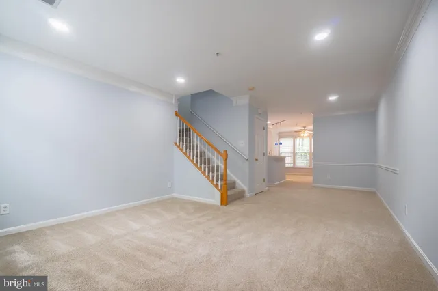 a view of an empty room with stairs