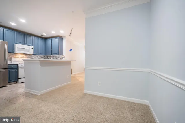 a view of kitchen with wooden floor