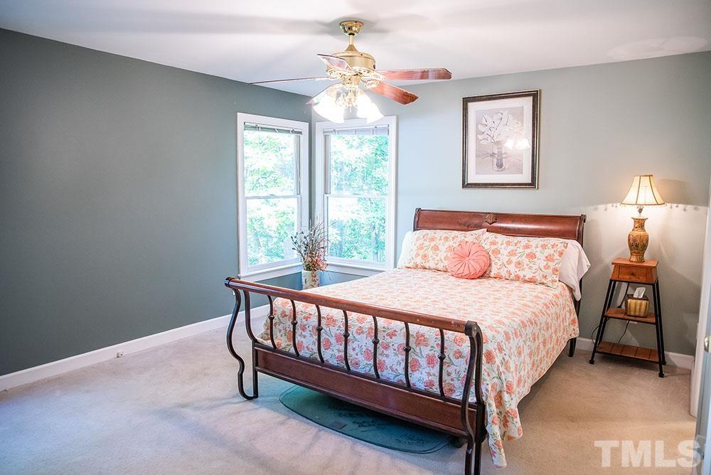150 Shannon Road Timberlake, NC 27583 - Photo 14 of 30 a bedroom with a bed and a window