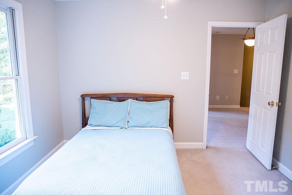 150 Shannon Road Timberlake, NC 27583 - Photo 24 of 30 a bedroom with a bed and a window