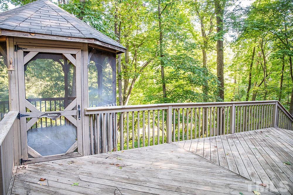 150 Shannon Road Timberlake, NC 27583 - Photo 26 of 30 a view of balcony with wooden floor