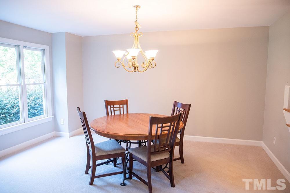 150 Shannon Road Timberlake, NC 27583 - Photo 4 of 30 a dining room with furniture a rug and a window