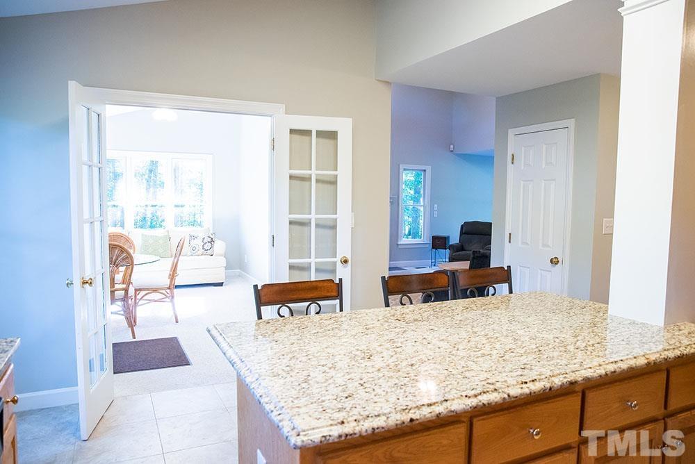 150 Shannon Road Timberlake, NC 27583 - Photo 10 of 30 a living room with granite countertop and couch