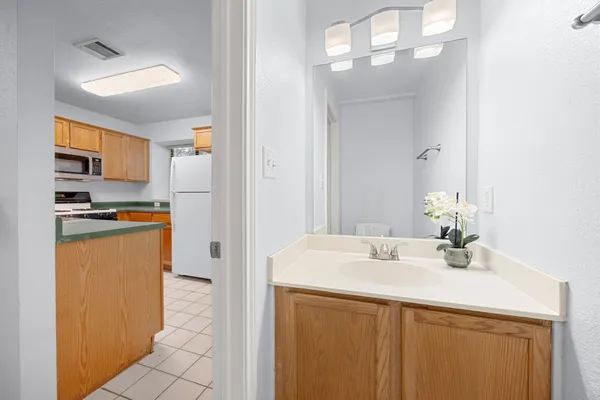 a kitchen with stainless steel appliances a sink stove and refrigerator