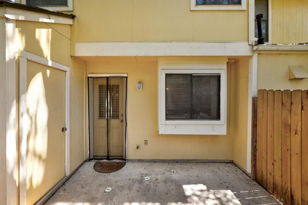 a view of a hallway with a wooden door