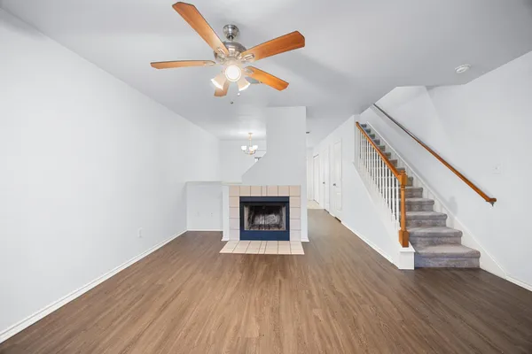 wooden floor in an empty room with a fireplace