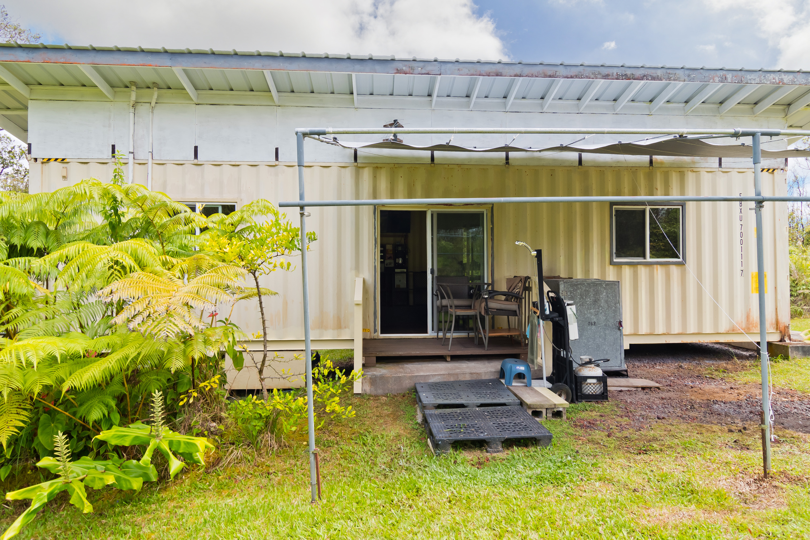 11-2430 Makoa Road Mountain View, HI 96771 - Photo 21 of 30 a front view of a house with a yard